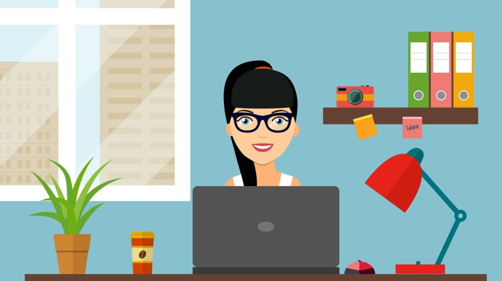Freelancer woman working at her office desk | Distractions When Working From Home And How To Avoid Them | how to avoid distractions | work from home tips | Featured