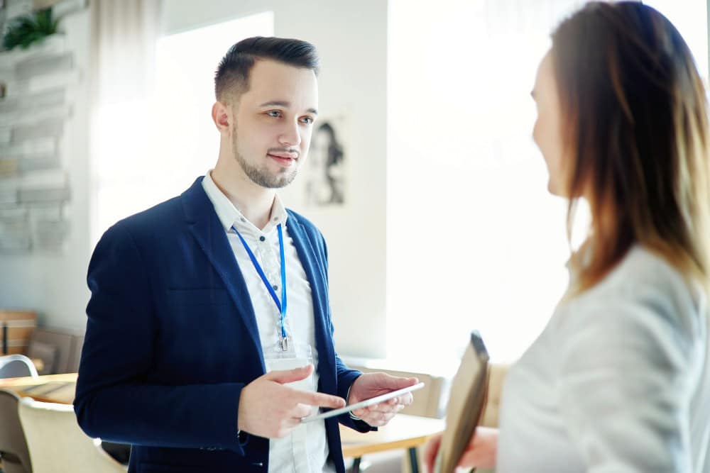 Confident young businessman holding a tablet | Fail-Proof Networking Strategies For Bookkeepers | accounting networking