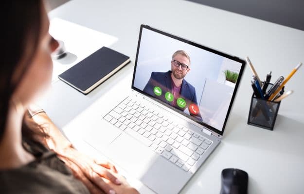 business woman having video call on computer ss