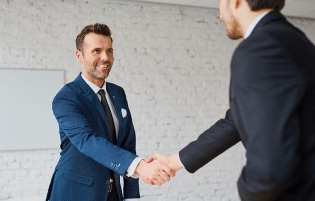 Businessmen handshaking after successful business meeting negotiation ss