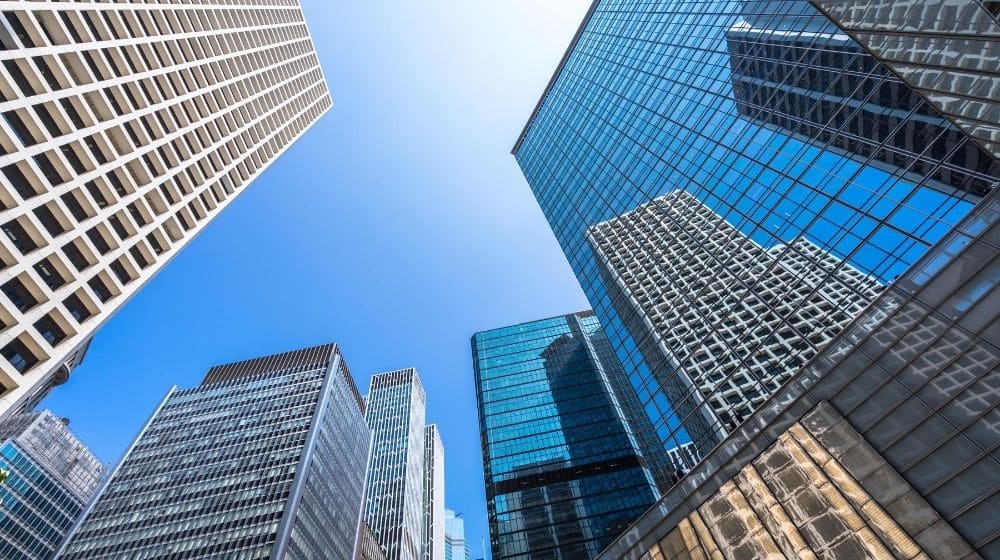 many skyscrapers surrounding with the blue sky feature CA