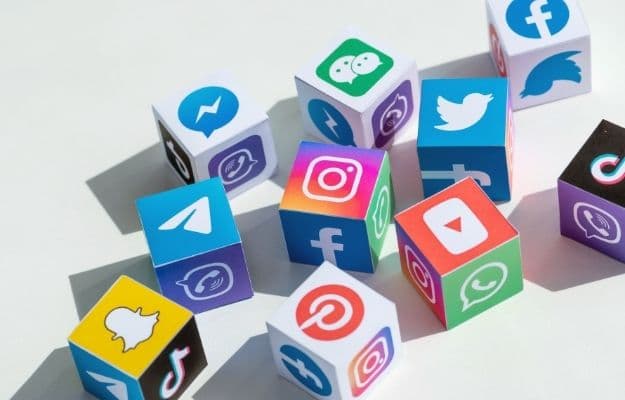 A paper cubes collection with printed logos of world-famous social networks | 11 Things To Do To Generate More Business | Use Social Media