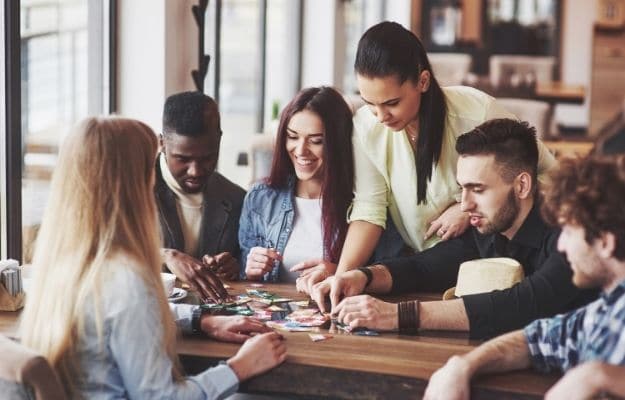 People having fun while playing board game ss