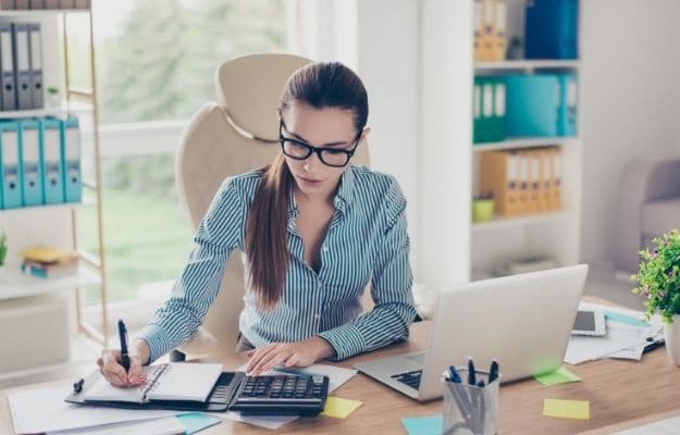 Portrait of serious young bookkeeper in formal wear ss