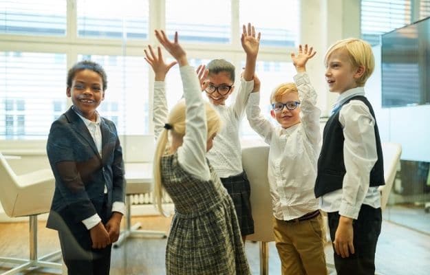 group of kids wearing business clothes ca